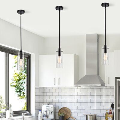 Revise your lighting scheme for simplicity and efficiency with this pendant ceiling lamp. This lamp has a matte finish. This lamp holds one bulb to provide multidirectional illumination for excellent indoor visibility. | Ebern Designs Gwynavere 1 - Light Single Cylinder Pendant Glass in Black, Size 11.0 H x 9.0 W x 9.0 D in | Wayfair Design, Black Pendant Light Kitchen, Black Pendant Lights Over Island, Black Pendant Light Fixtures, Black Light Fixtures Dining Room, Modern Pendant Lighting Kitchen Island, Kitchen Island Lighting Pendant, Pendant Light Fixtures, Glass Shade Pendant Light