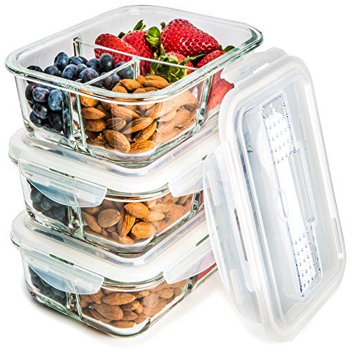 three plastic containers filled with different types of fruit and nuts, one containing almonds, the other blueberries and strawberries