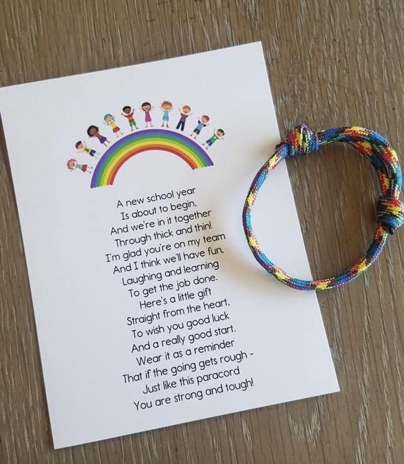 a rainbow bracelet next to a poem on a piece of paper that says,'a new school year is always beginners in together through the rainbows