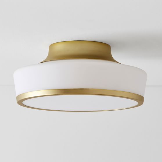 a white and gold ceiling light hanging from the ceiling