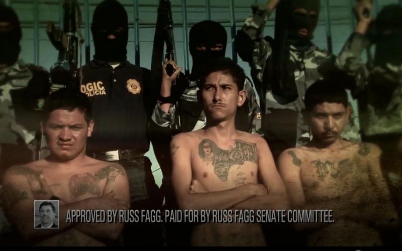 Campaign ad picturing tattooed gang members