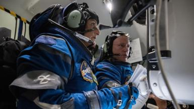astronauts in spacecraft