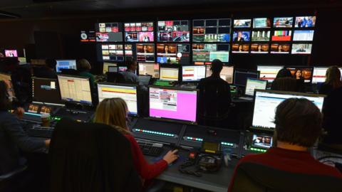 People working in a TV gallery at BBC World News
