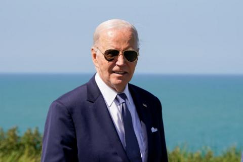 US President Joe Biden looks on, during a visit to the World War II Pointe du Hoc Ranger Monument in Normandy