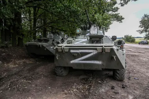This photograph taken on September 10, 2022 shows Russian military vehicles in Balakliya, Kharkiv region