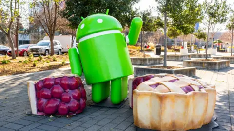 Getty Images A sculpture of the Android logo with slices of pie sculptures