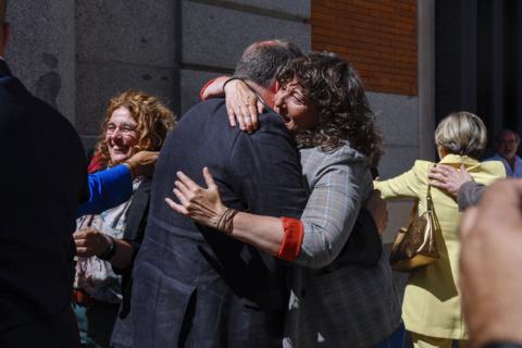 Pro-Catalan independence MPs hug each other celebrating the passing of an amnesty law