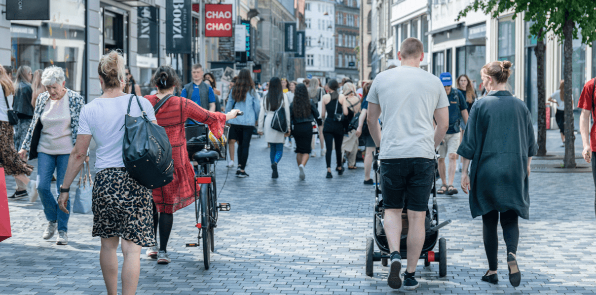 Photo of a busy shopping street in Copenhagen with many people walking