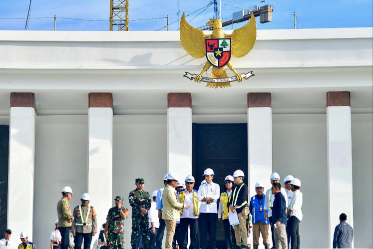 This handout picture taken and released on June 5, 2024 by the Presidential Palace shows President Joko “Jokowi“ Widodo (center) inspecting the venue that will be used for the celebration of Indonesia's 79th Independence Day in the future capital city of Nusantara in Penajam Paser Utara, East Kalimantan. 
