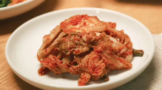 A serving of kimchi on a white plate
