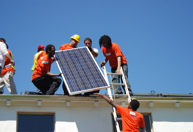 Photo of a solar panel being installed on a rooftop