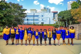 Group picture of Sigma Gama Rho, Incorporated Sorority wearing their letters and sorority colors.