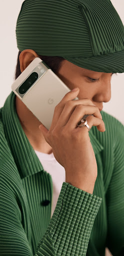 A person taking a call on their Pixel phone.