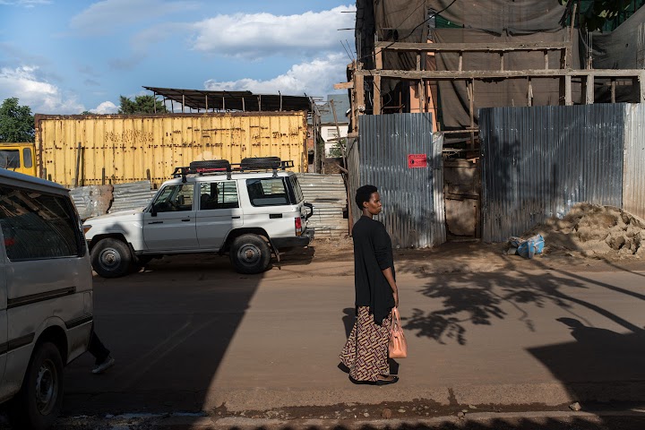 Clementine walking along a street in Bukavu, Democratic Republic of Congo.