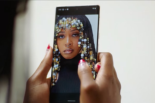 A high quality photo of a Black woman appears on a Pixel phone screen