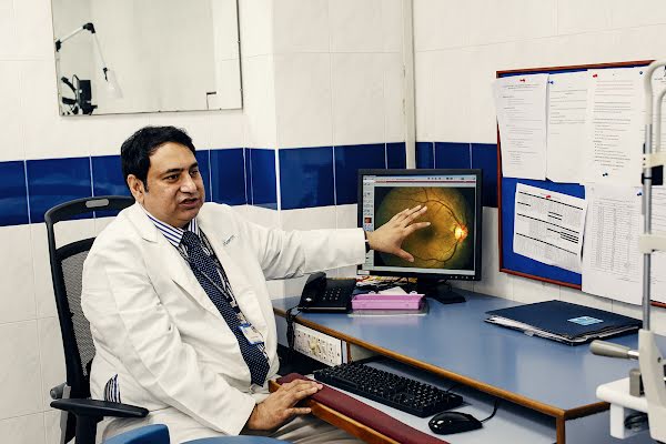 Dr. Rajiv Raman reviews a patient's retina image of signs of diabetic retinopathy.