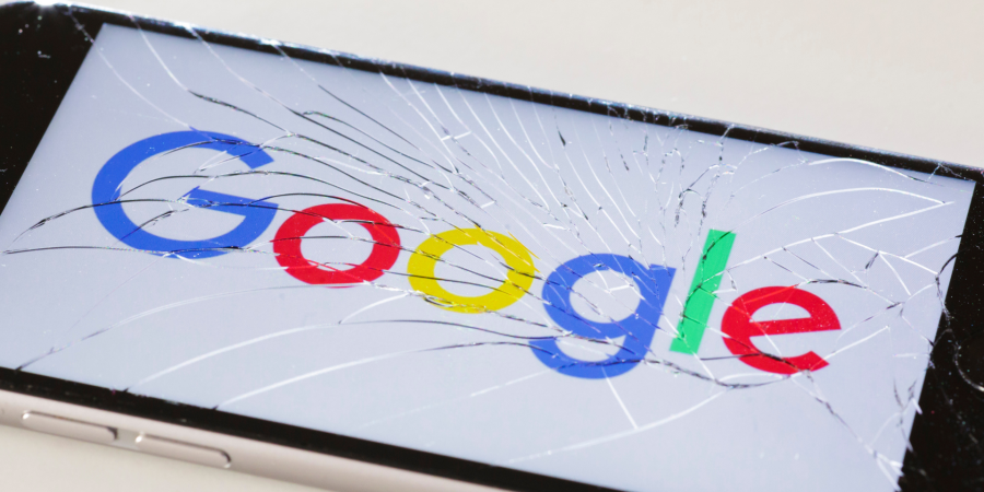 The Google logo displayed on a cracked phone screen