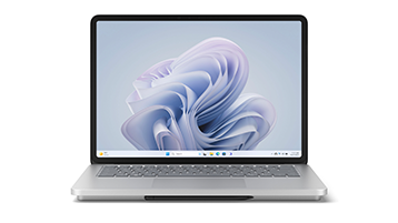 笔记本模式下的 Surface Laptop Studio 2，以正面视图显示，屏幕上显示有 Windows bloom 图像。