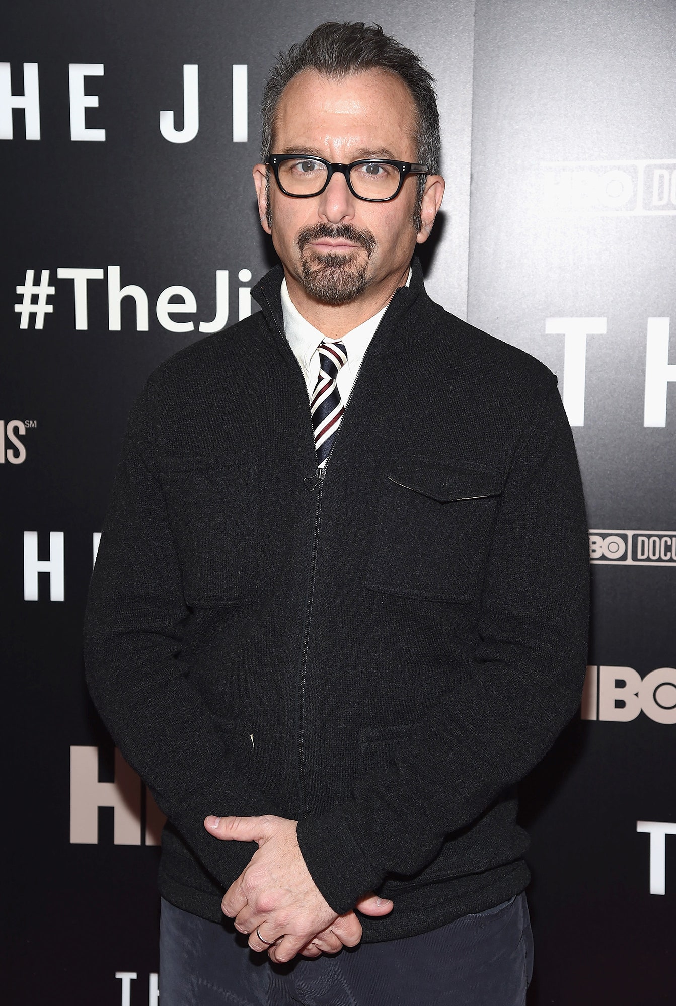 Image may contain Andrew Jarecki Fashion Adult Person Accessories Glasses Formal Wear Tie Clothing and Coat
