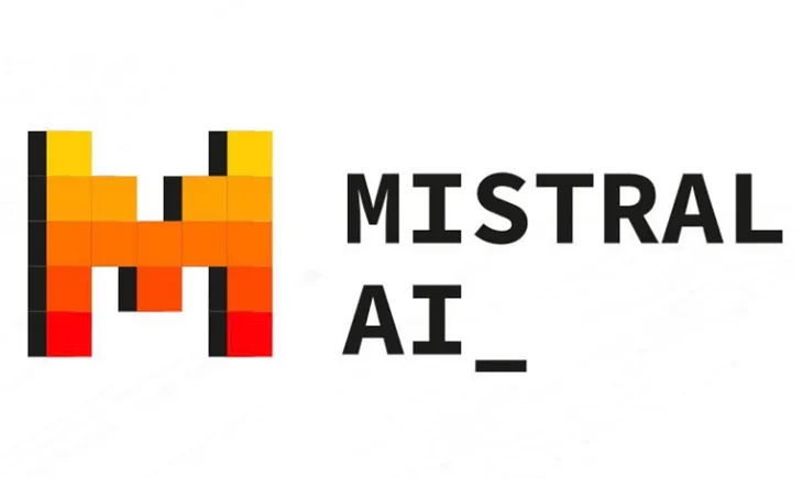 IMAGE: Mistyral.ai logo, a big and pixelated “M” in a degradation from red at the bottom to yellow at the top, and the words “MISTRAL AI_” in black capital letters