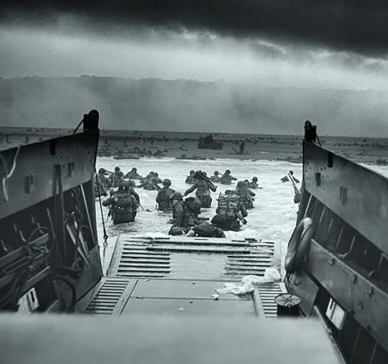Soldiers landing on a beach during World War II