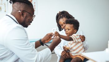 Pediatric Checkup for Young Boy with Supportive Mother