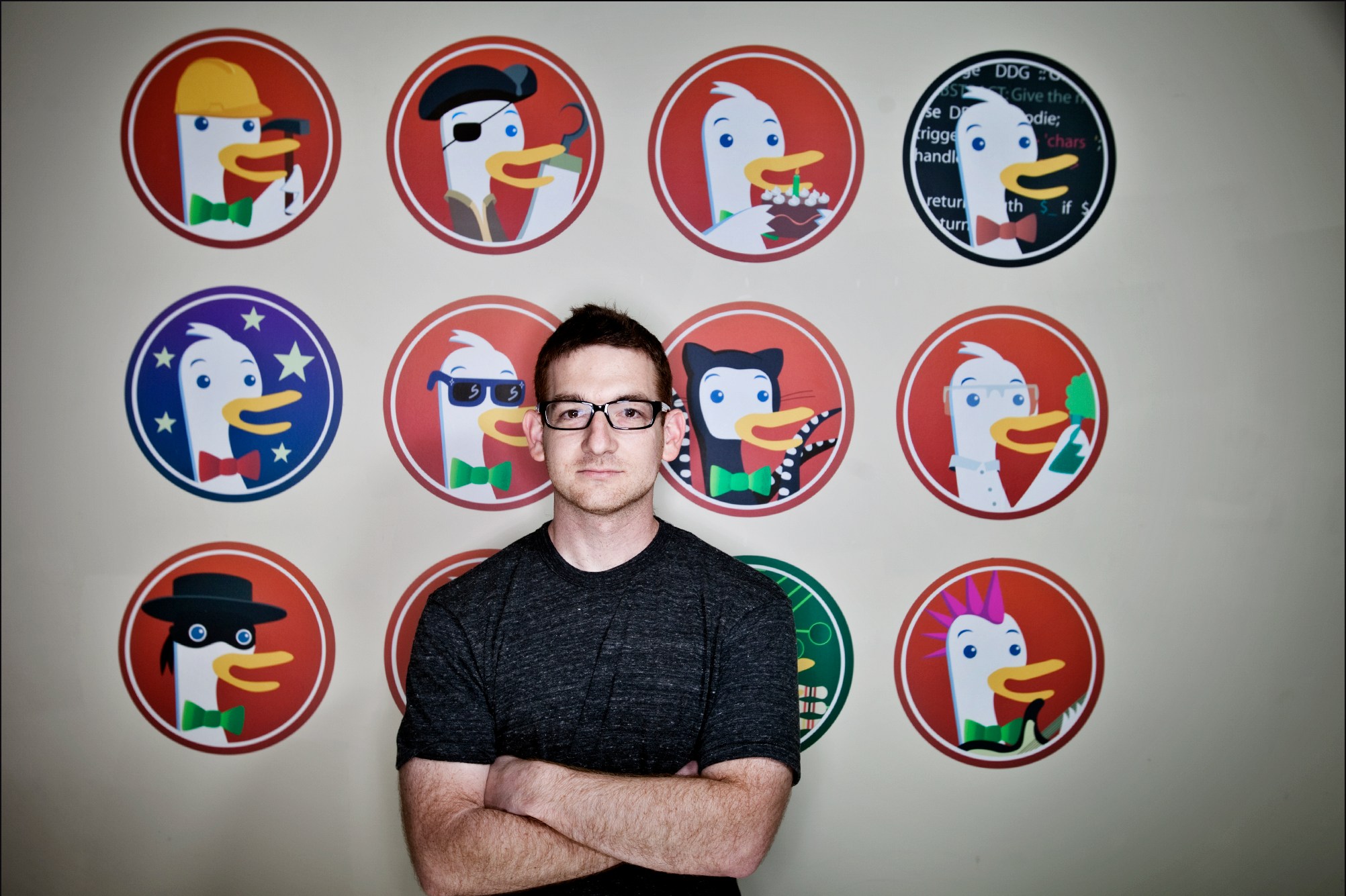 Gabriel Weinberg, CEO of DuckDuckGo, standing in front of a wall decorated with duck cartoons, in 2012.