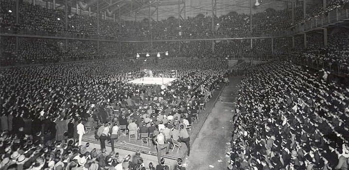 huge crowd around a boxing ring