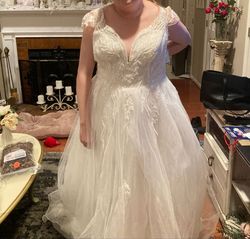 Style V10003 N/S Ivory with Cathedral Matching Veil priced at $279.00 Oleg Cassini White Size 18 Tulle Plus Size Medium Height A-line Dress on Queenly