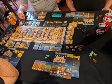 Wayfarers of the South Tigris is a high complexity board game combining dice manipulation and placement, tableau building, and worker placement. Explore the land and sea while mapping the stars and recruiting townsfolk to aid you.