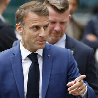France's President Emmanuel Macron leaves the polling station after voting for the first round of parliamentary elections in Le Touquet, northern France on June 30, 2024. (Ludovic Marin / AFP)