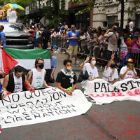 Pro-Palestinian, anti-Israel protesters block the parade route during the NYC Pride March, June 30, 2024, in New York. (Charles Sykes/Invision/AP)