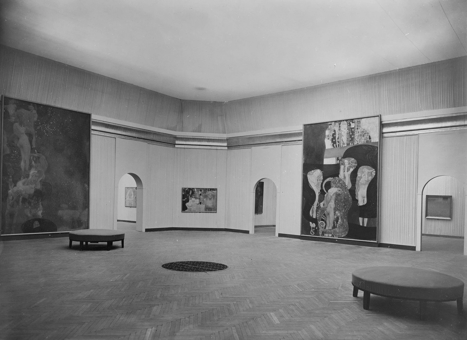 A black-and-white photograph from 1928 showing the original Faculty Paintings at the 99th Vienna Secession exhibition.