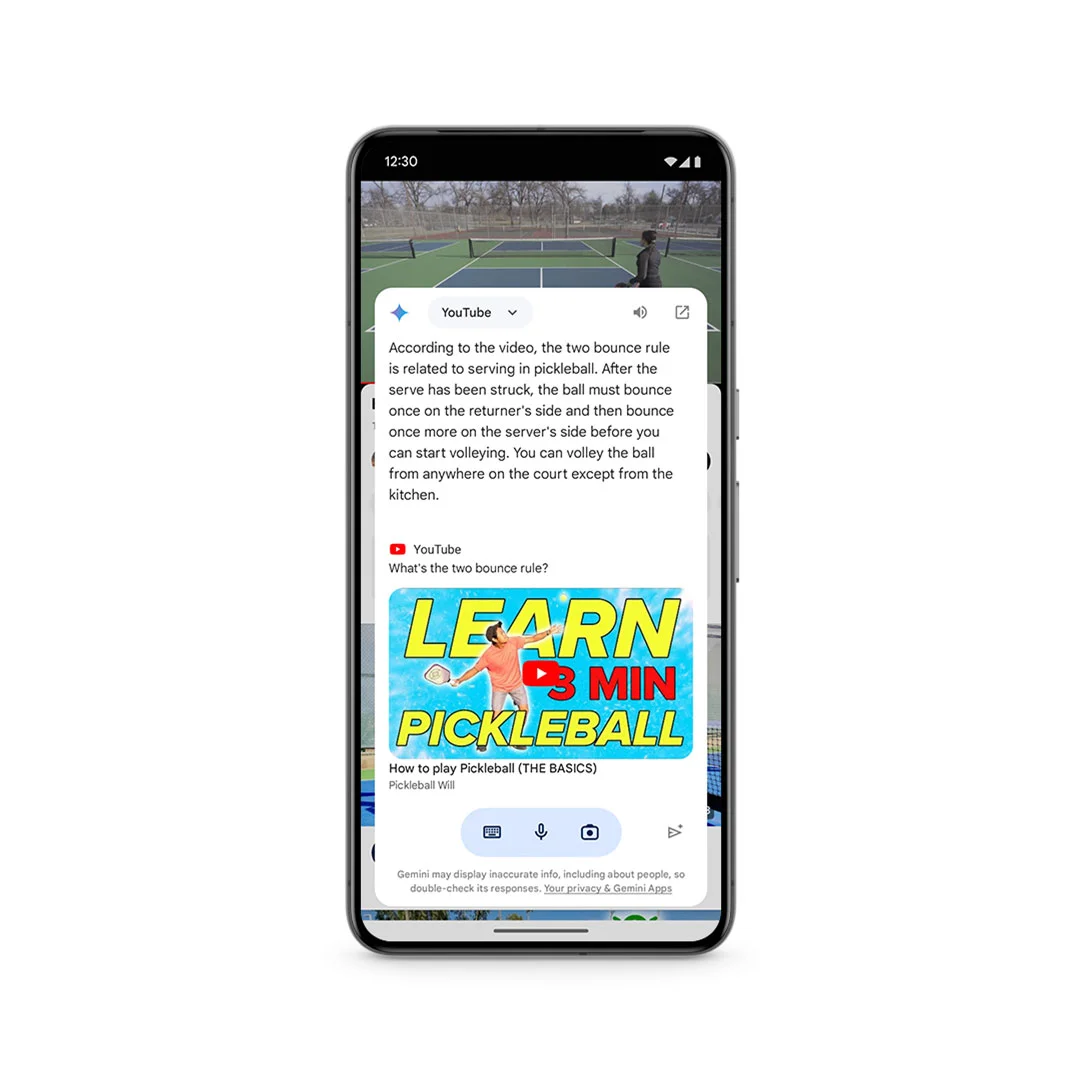 Phone frame showing an overlay with text that answers a question about a pickleball video. Below the text shows the video’s title card that says Learn Pickleball in 3 Minutes. Under the overlay is part of the video playing on YouTube of a pickleball court.