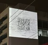 QR Code teasing Taylor Swift's new single Fortnight projected on a building in Sydney, Australia