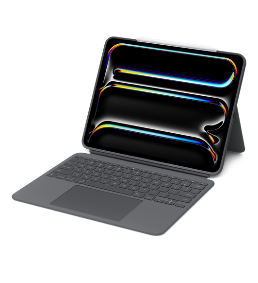 Liggende, tastatur og iPad Pro med støtten i bruk