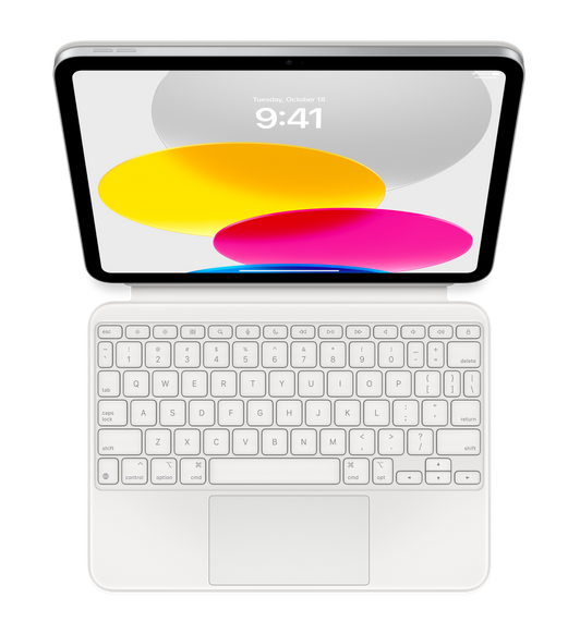 iPad set ovenfra med et tilsluttet Magic Keyboard Folio, som ligger fladt. Skærmen viser grafik med farvede cirkler.