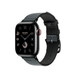 Toile H Simple Tour-armband i Noir (svart) och Denim (blå). På bilden syns urtavlan på Apple Watch och Digital Crown.