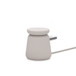 Belkin Boost Charge Pro 2-in-1 Wireless Charging Dock with MagSafe in Sand color. MagSafe puck laying flat.