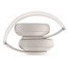 Beats Studio Pro Wireless Headphones in Sandstone, in folded position for storing in included carrying case.