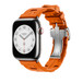 Image montrant le bracelet Kilim simple tour orange, le cadran d’une Apple Watch et la Digital Crown.