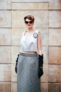 Givenchy GivCut sunglasses; Marc Jacobs polyester, silk and elastane tank and 100 percent calf leather skirt; Hermès gloves.