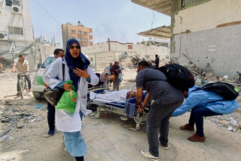 Palestinians evacuate Kamal Adwan hospital following an Israeli strike, amid the ongoing conflict between Israel and the Palestinian Islamist group Hamas, in Beit Lahia in the northern Gaza Strip, May 21, 2024.