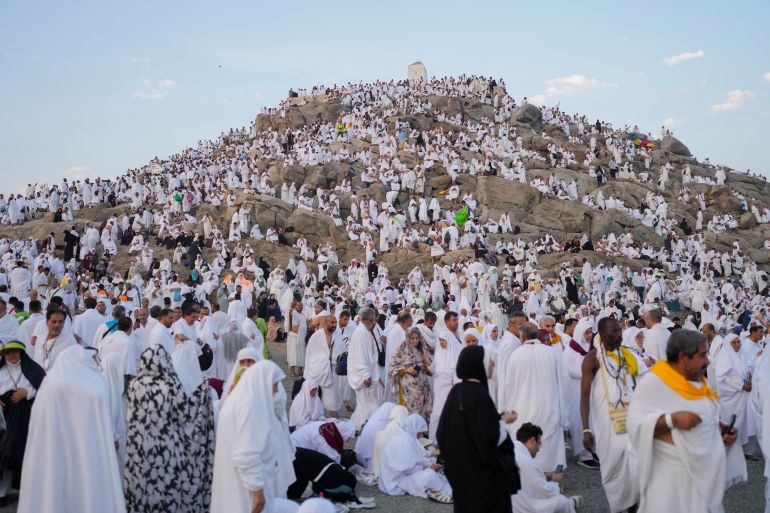 Muslim pilgrims gather at the top of the rocky hill known as the Mountain of Mercy, on the Plain of Arafat, during the annual Hajj pilgrimage, near the holy city of Mecca, Saudi Arabia, Saturday, June 15