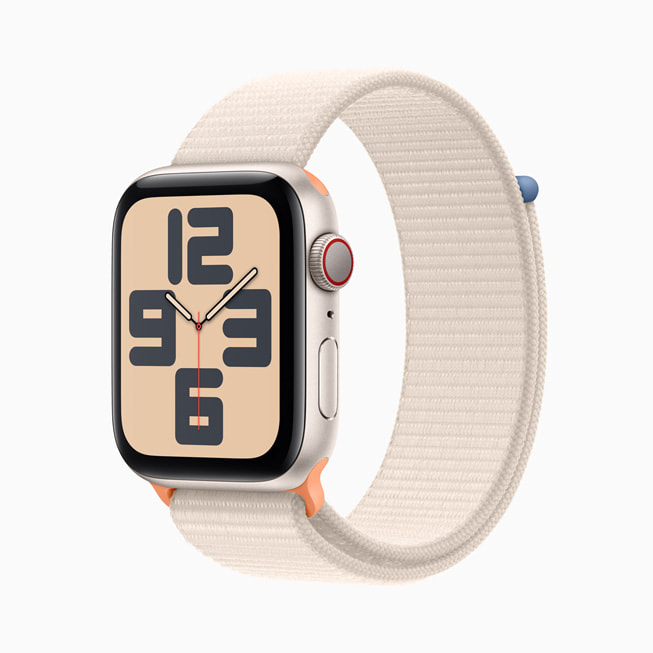 Apple Watch SE au boîtier comète en aluminium avec un bracelet sport poussière stellaire.