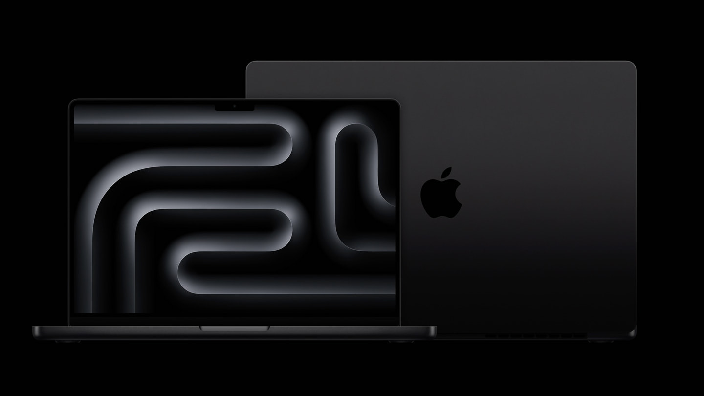 Dois notebooks MacBook Pro sobre um fundo preto. Um está virado para frente e o outro está de costas.