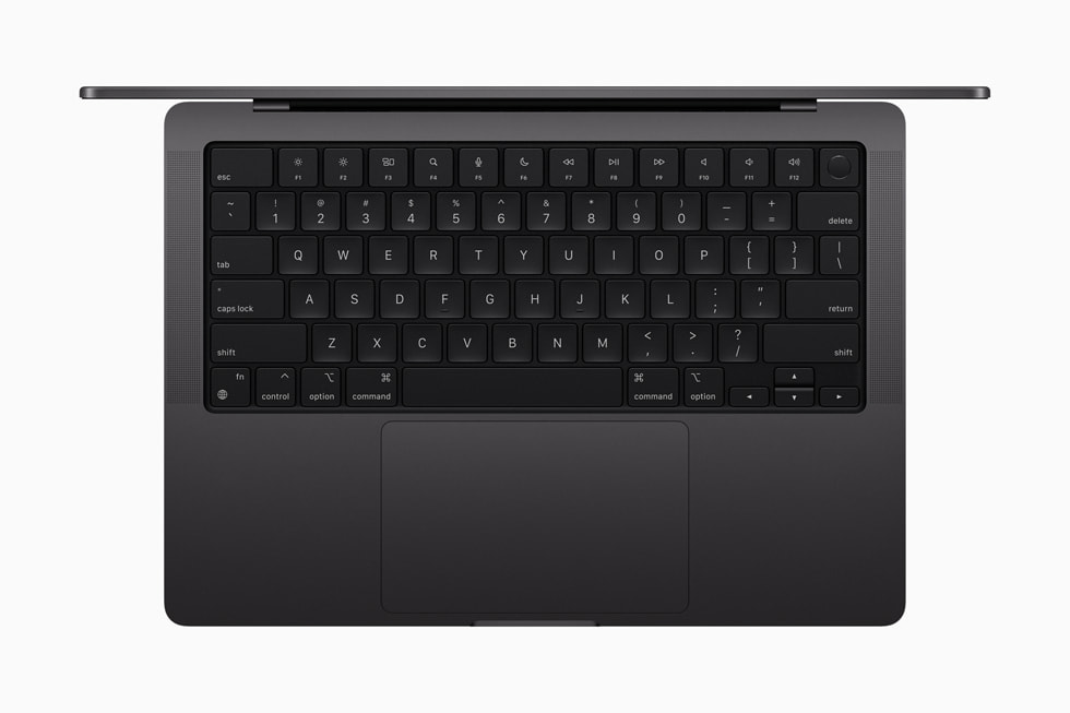 Imagem de cima do novo MacBook Pro em preto-espacial, que destaca o teclado.