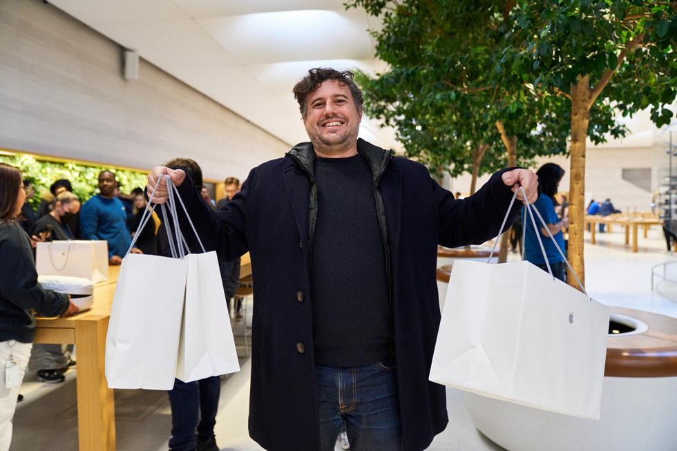 A customer with multiple Apple bags at Apple Fifth Avenue.