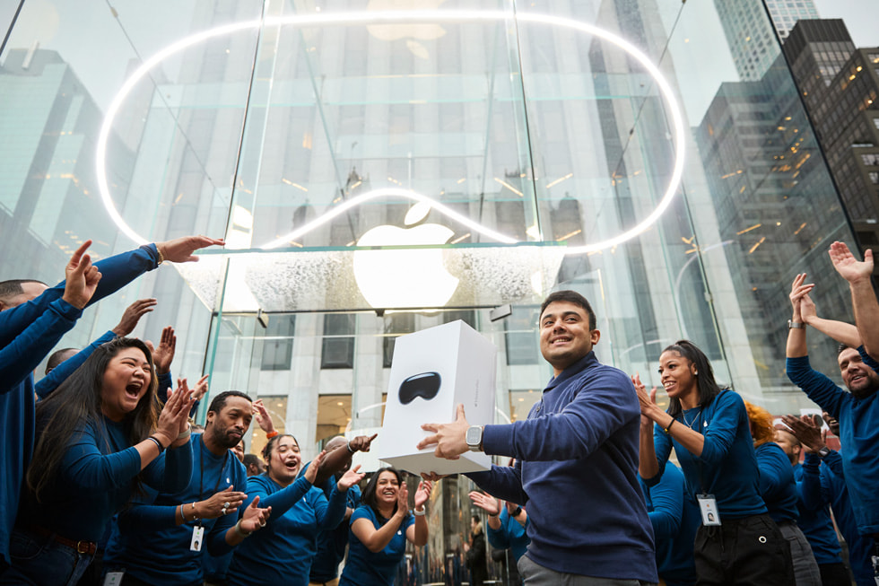 The first customer leaving Apple Fifth Avenue holding Apple Vision Pro.