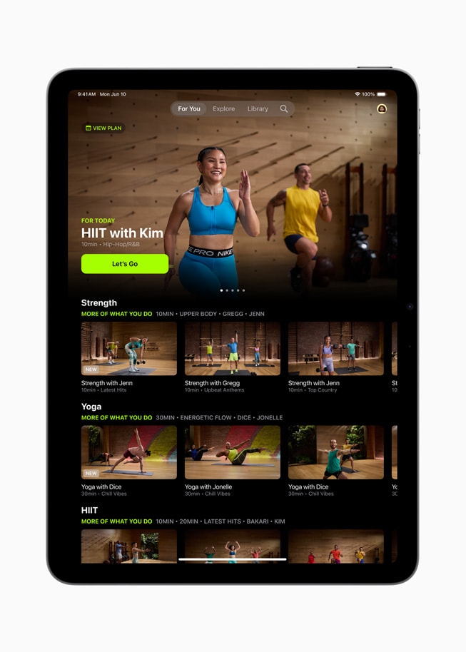 The redesigned Apple Fitness+ experience is shown on iPad Pro.